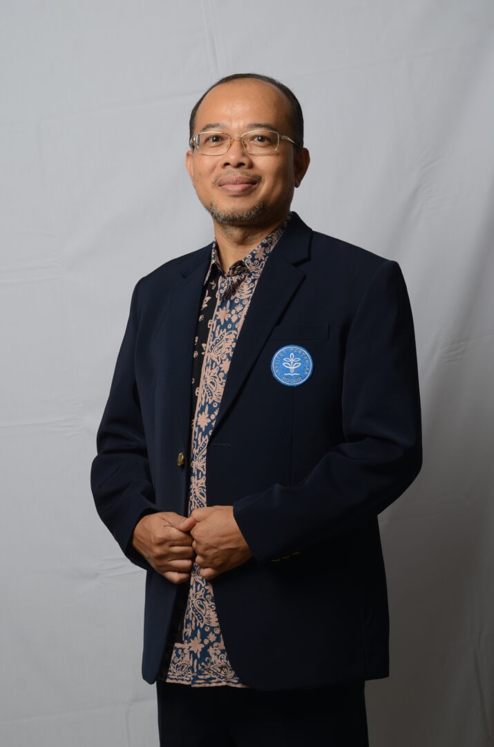 Food technology expert Eko Hari Purnomo posing for a photo with hands in front holding his blazer together