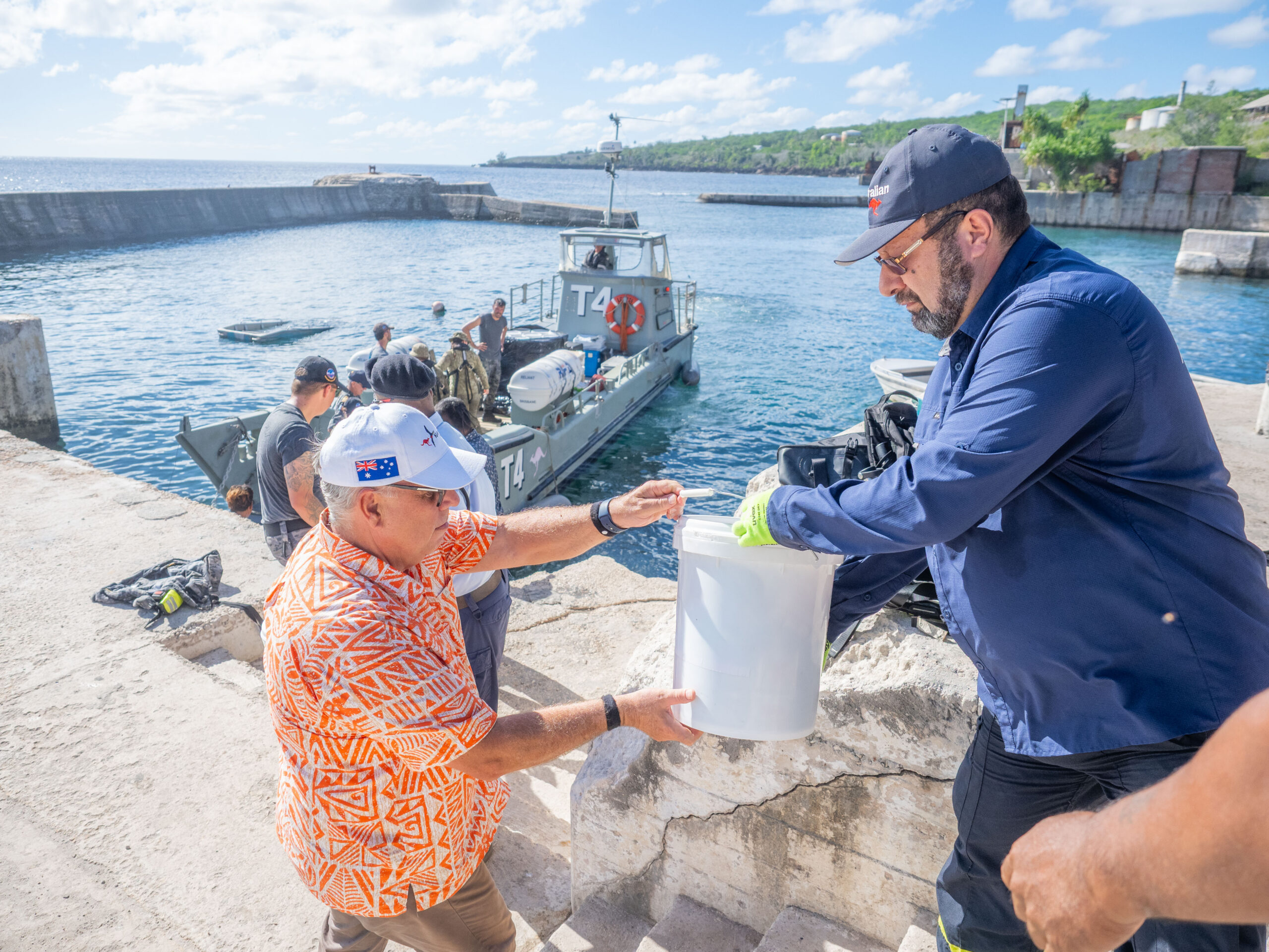 Australian High Commissioner to Kiribati, His Excellency Mark Foxe and other delegates from the Government of Kiribati and Australian High Commission discharging humanitarian supplies for ADV Reliant’s landing craft on Banaba Island.